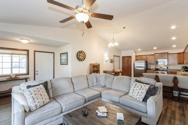 living area with recessed lighting, ceiling fan with notable chandelier, dark wood-style floors, and vaulted ceiling