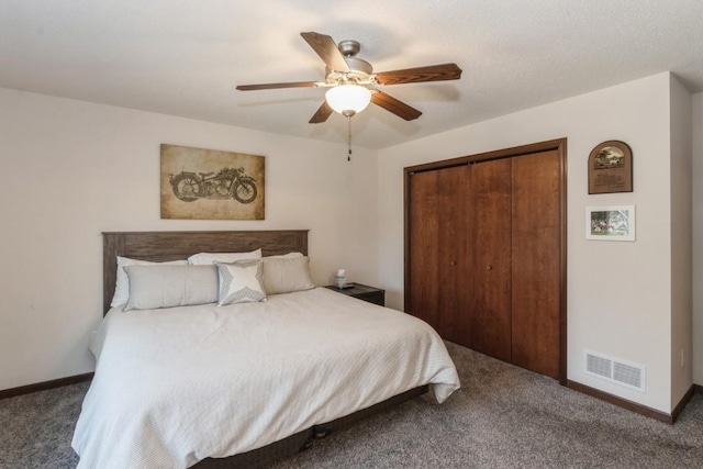 carpeted bedroom featuring visible vents, baseboards, a closet, and ceiling fan