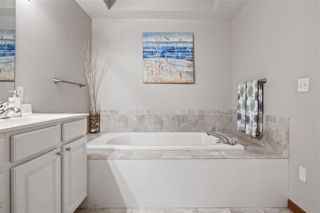 bathroom featuring vanity and a garden tub