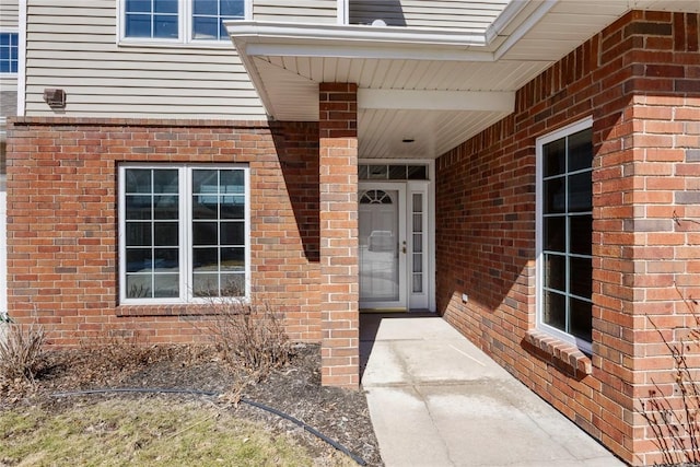 entrance to property with brick siding