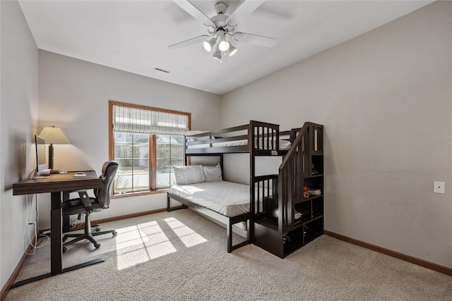 bedroom with carpet flooring, visible vents, baseboards, and ceiling fan