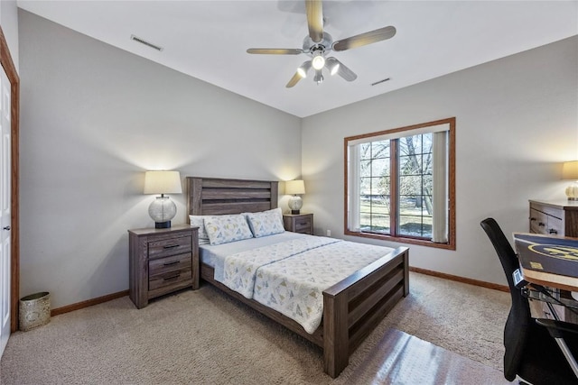 bedroom featuring ceiling fan, light colored carpet, visible vents, and baseboards