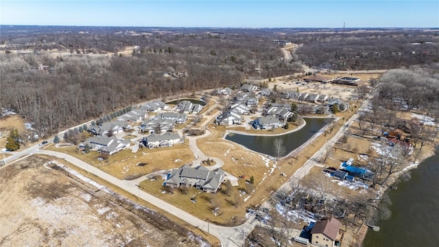 birds eye view of property with a residential view and a water view