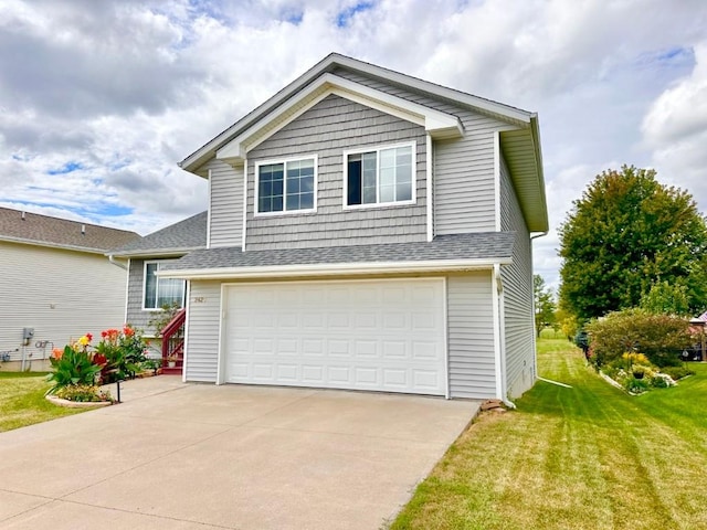 view of front of home featuring an attached garage and a front yard