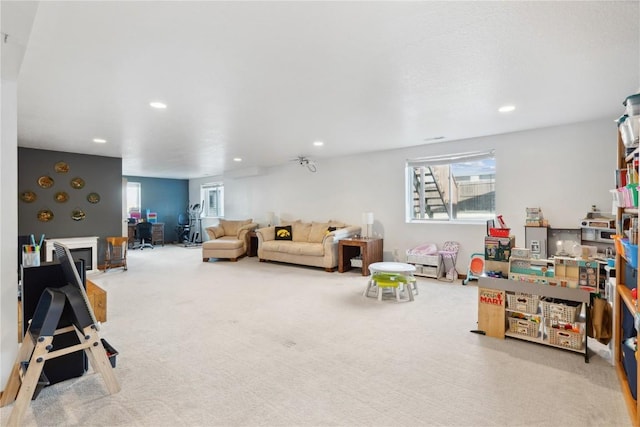 carpeted living room featuring recessed lighting and a healthy amount of sunlight