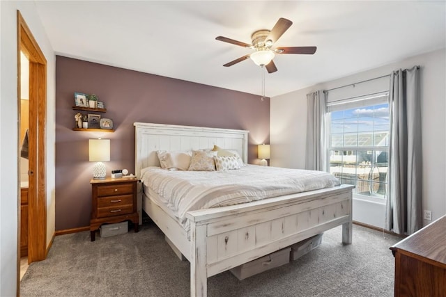 bedroom with baseboards, a ceiling fan, and carpet flooring