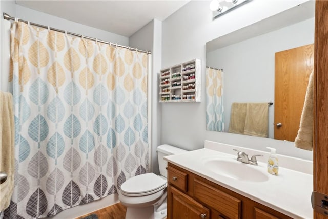 full bath with a shower with curtain, toilet, and vanity