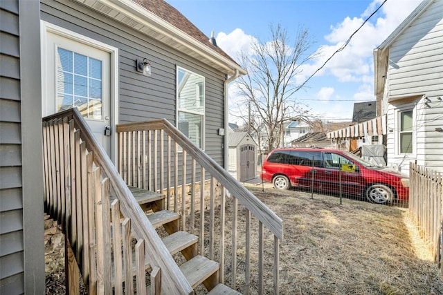 property entrance featuring a residential view and fence