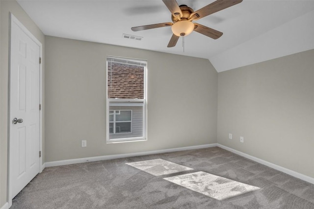 empty room with visible vents, baseboards, carpet, and a ceiling fan