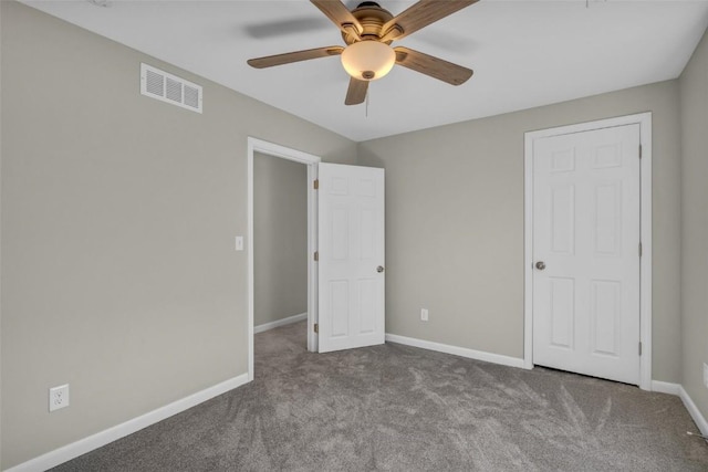 unfurnished bedroom with visible vents, baseboards, carpet floors, and a ceiling fan