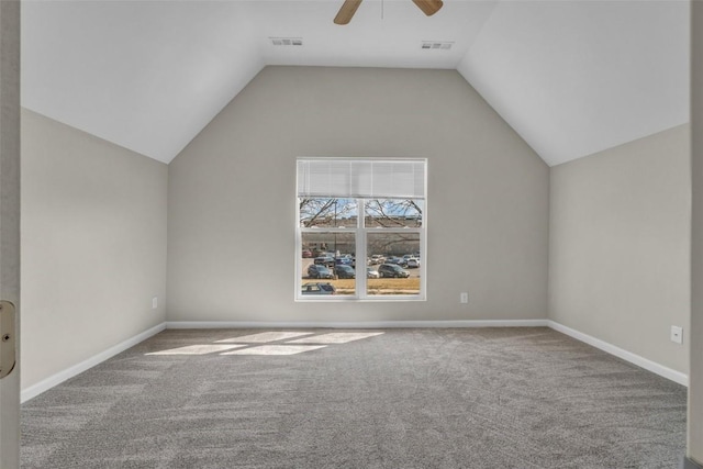 additional living space featuring visible vents, a ceiling fan, and vaulted ceiling