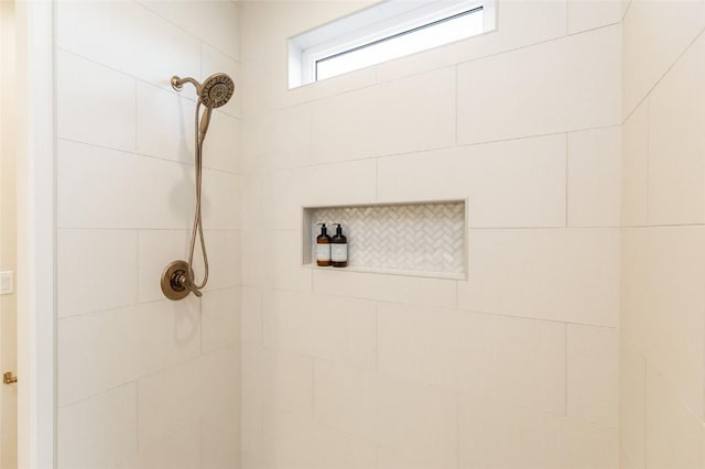 full bath featuring tiled shower