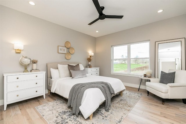 bedroom with light wood finished floors, recessed lighting, a ceiling fan, and baseboards