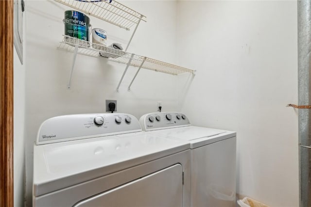 clothes washing area with laundry area and washer and clothes dryer