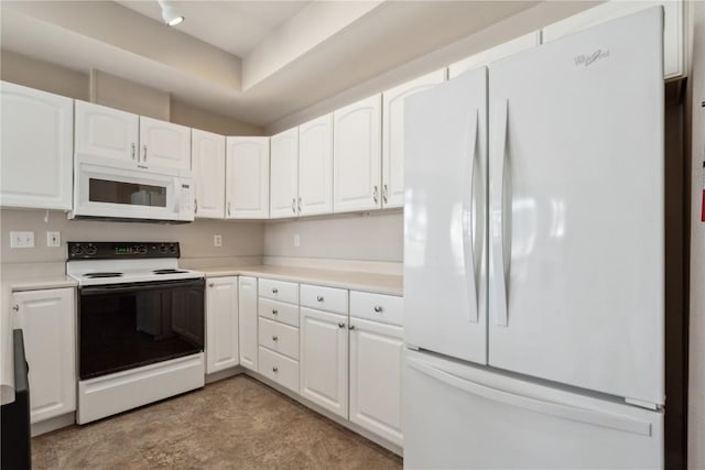 kitchen featuring white appliances, white cabinetry, and light countertops