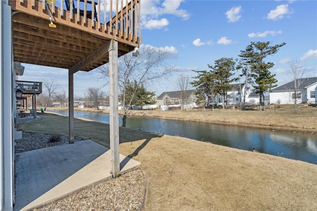 view of patio with a water view