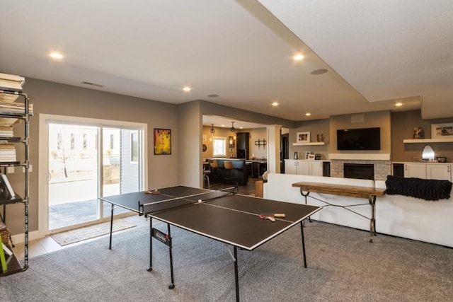 playroom with carpet, recessed lighting, visible vents, and a fireplace