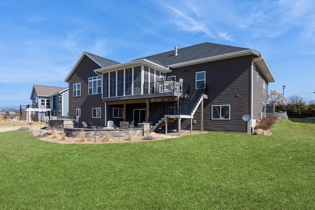 rear view of house featuring a patio, a lawn, stairs, and a sunroom