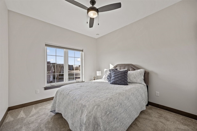 bedroom featuring carpet flooring, a ceiling fan, and baseboards