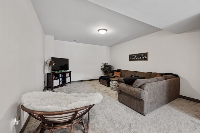 carpeted living room with baseboards