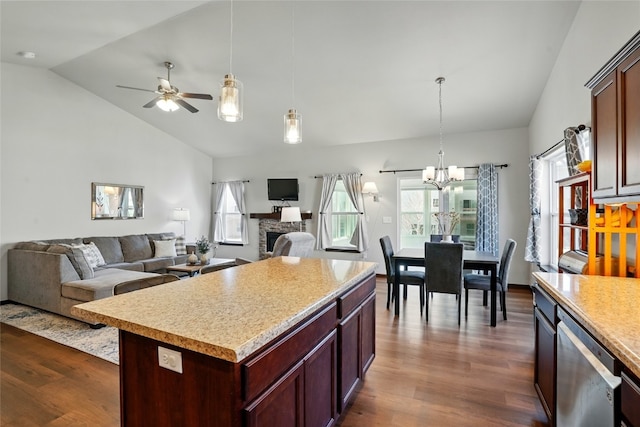 kitchen with dark wood finished floors, open floor plan, dishwasher, and light countertops