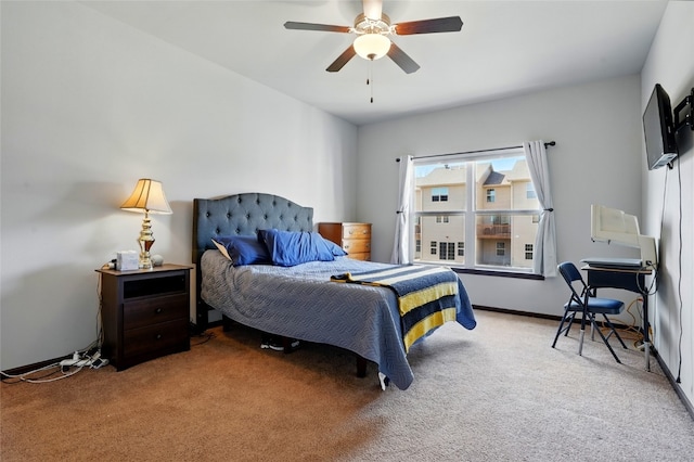 carpeted bedroom featuring baseboards and ceiling fan