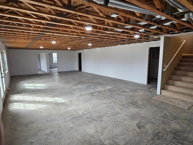 basement featuring stairs