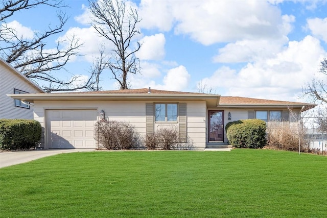 ranch-style home with a garage, a front lawn, and driveway