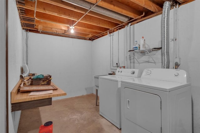 laundry area featuring washing machine and clothes dryer and laundry area