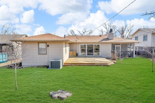 rear view of house with fence, central AC, a lawn, a chimney, and a deck