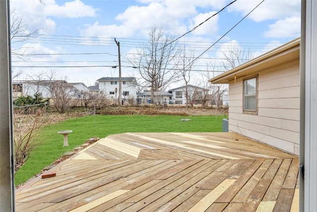 deck with a lawn and fence