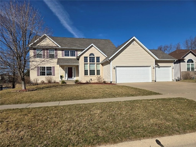 traditional home featuring a front yard, an attached garage, and driveway