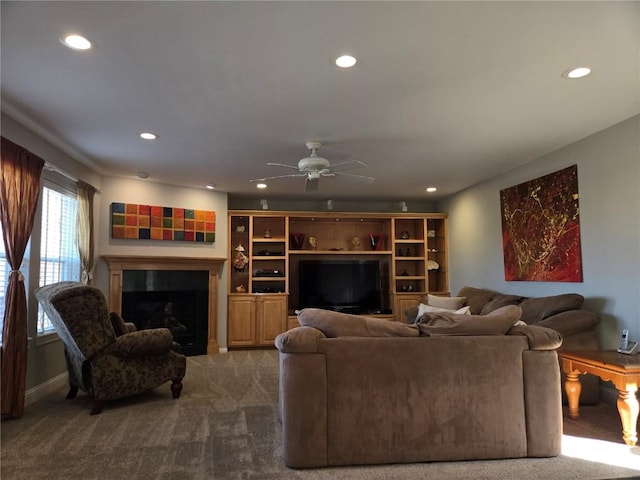 carpeted living room with recessed lighting, ceiling fan, and a fireplace