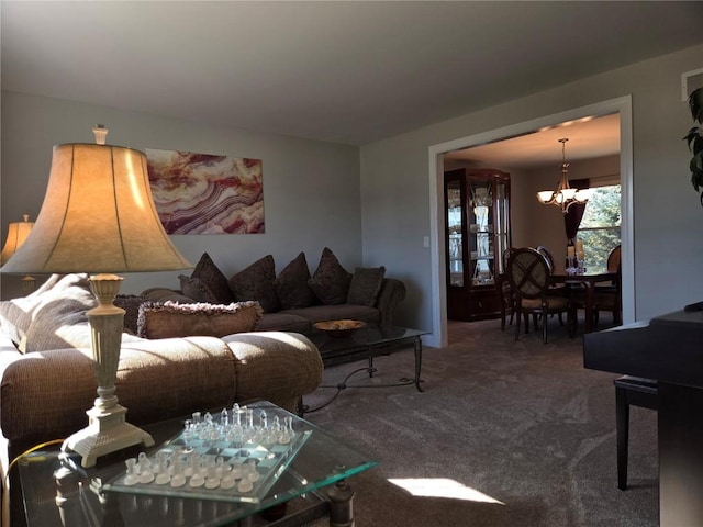 carpeted living room with a chandelier