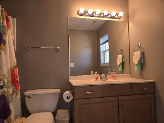 full bathroom featuring toilet and vanity