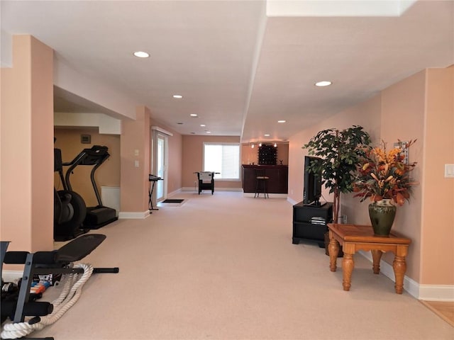 exercise area featuring carpet, recessed lighting, and baseboards