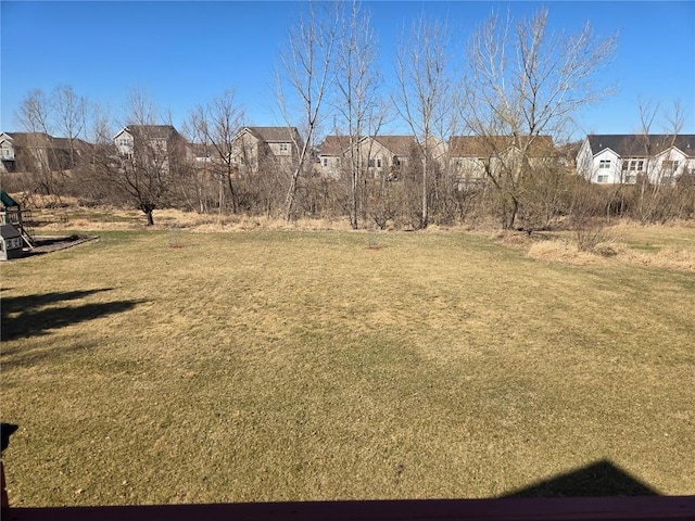 view of yard featuring a residential view