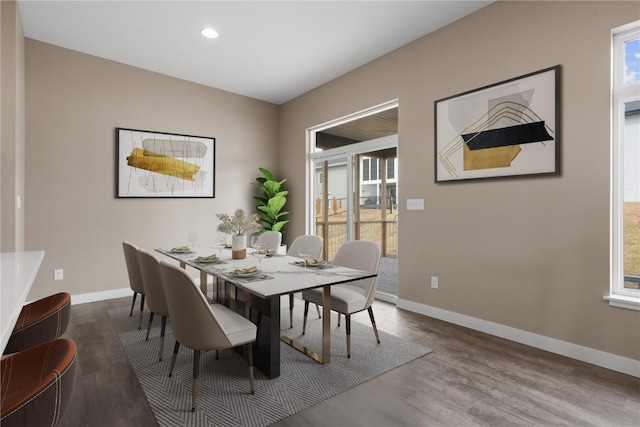 dining space with recessed lighting, wood finished floors, and baseboards