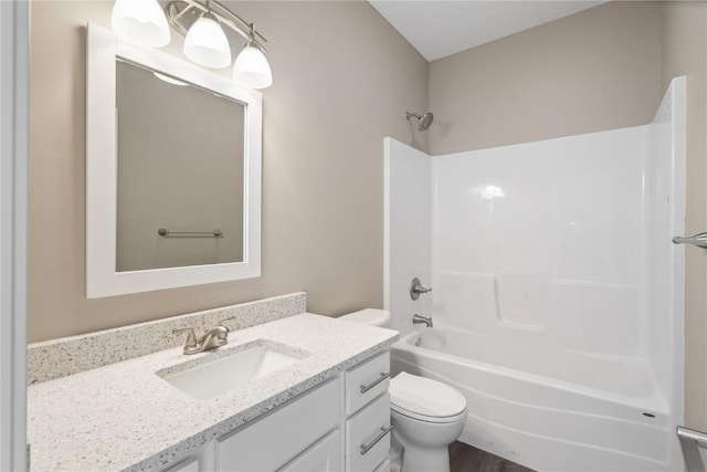 full bath featuring vanity, toilet, and bathing tub / shower combination
