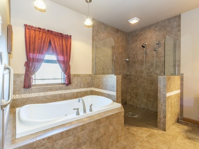 bathroom with tile patterned flooring, a garden tub, and walk in shower