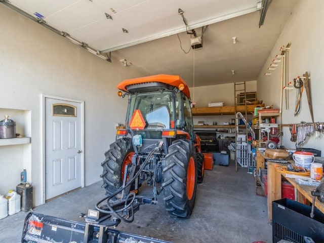 garage featuring a workshop area and a garage door opener