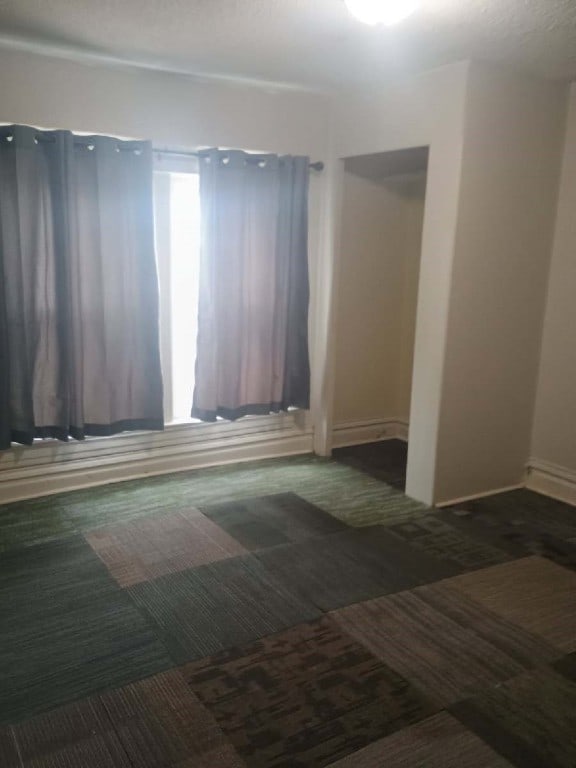 spare room with carpet flooring