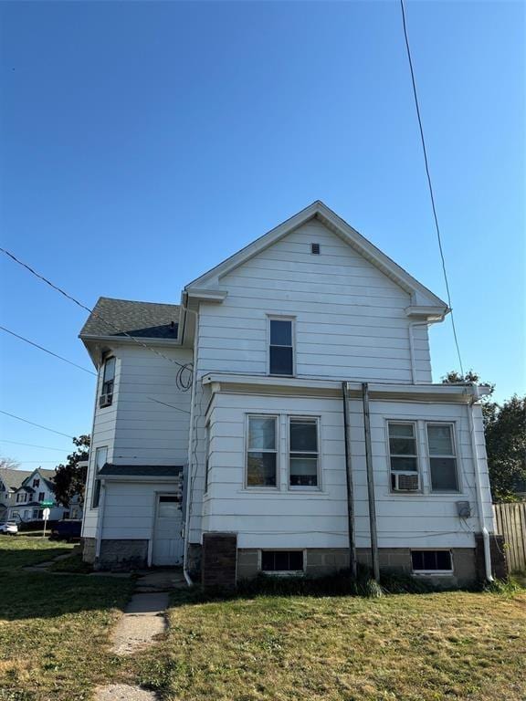 1416/1418 3rd Ave SE, Cedar Rapids, IA 52403 - rear view of house featuring a yard and cooling unit