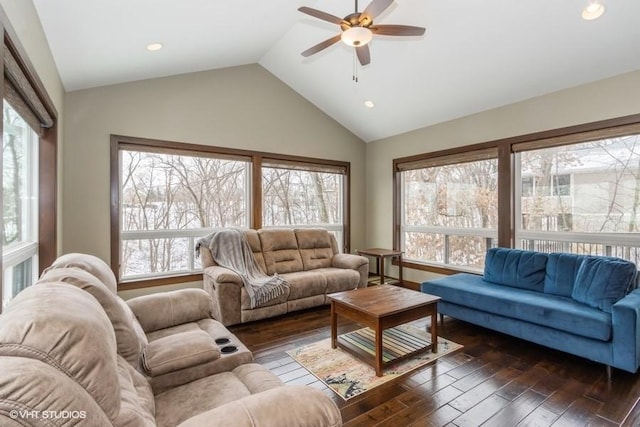 living area with a healthy amount of sunlight, ceiling fan, and dark wood-style flooring