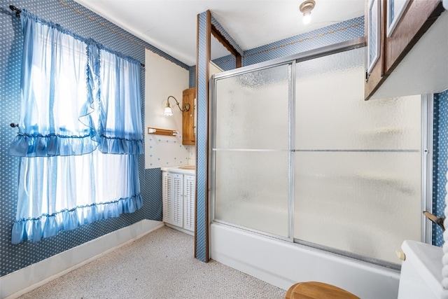 full bathroom with a healthy amount of sunlight and shower / bath combination with glass door