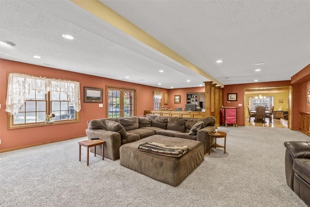 3098 Sandy Beach Rd NE, Solon, IA 52333 - carpeted living room with recessed lighting, a notable chandelier, and a textured ceiling