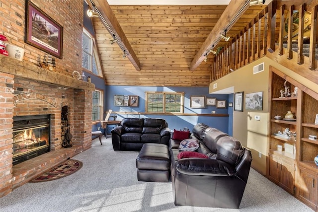 3098 Sandy Beach Rd NE, Solon, IA 52333 - living room with visible vents, beam ceiling, carpet, and wooden ceiling