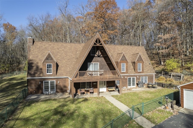 3098 Sandy Beach Rd NE, Solon, IA 52333 - view of front facade with a patio, a chimney, a fenced backyard, and a front yard