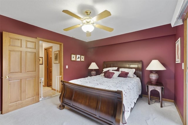 3098 Sandy Beach Rd NE, Solon, IA 52333 - bedroom featuring a ceiling fan, light colored carpet, and baseboards