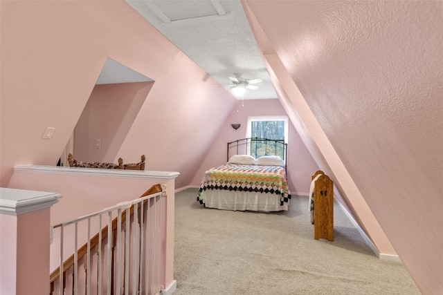 3098 Sandy Beach Rd NE, Solon, IA 52333 - bedroom featuring baseboards, carpet floors, ceiling fan, vaulted ceiling, and a textured ceiling